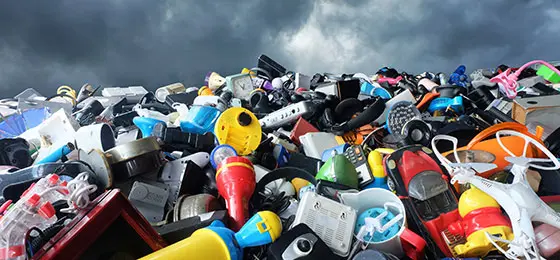 The image shows a mountain of waste.