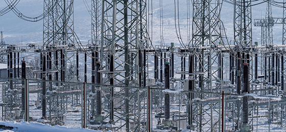 The image shows various components of an electricity grid.